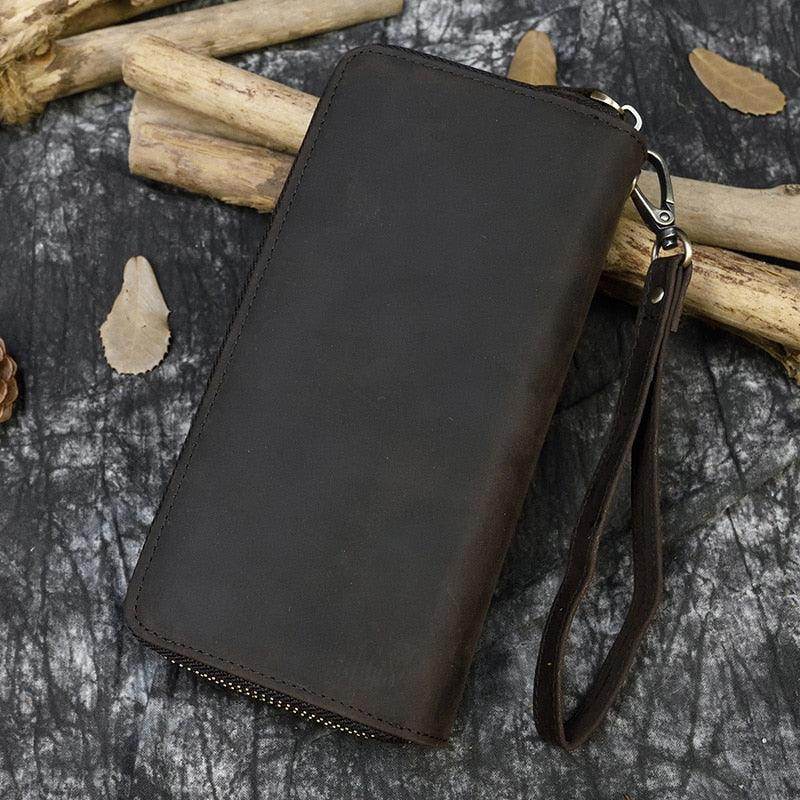 Crazy horse leather wallet with a sleek design and wrist strap for easy carrying
