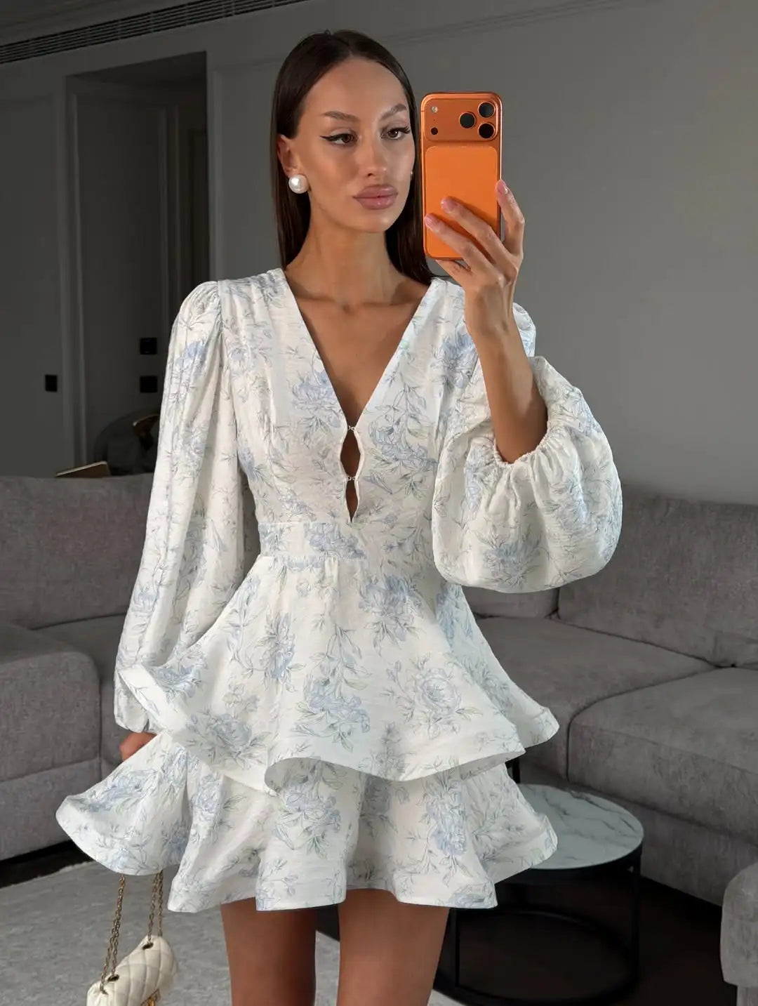 Women's floral mini dress in white with puff sleeves, perfect for summer outings