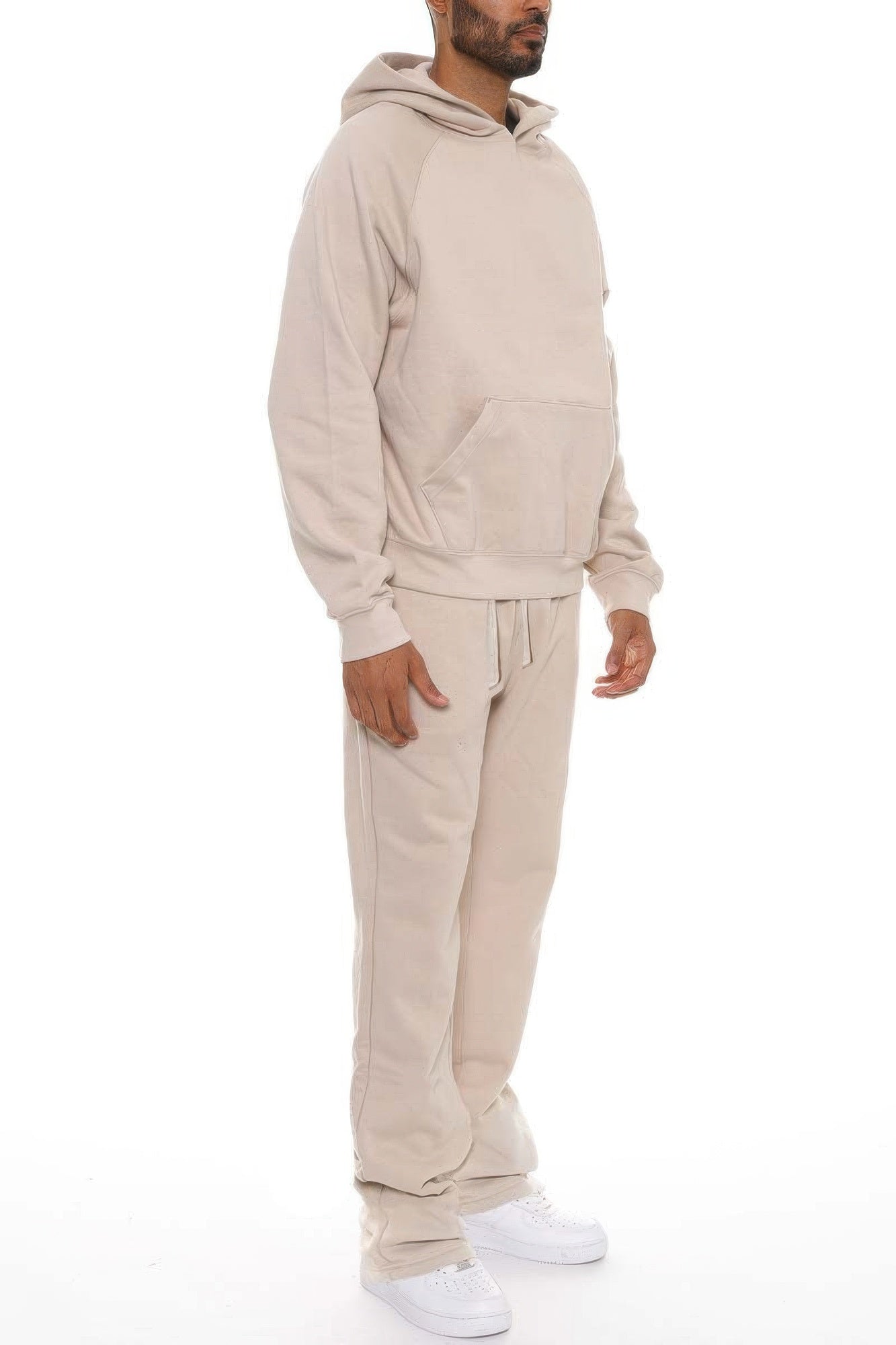 Men's beige flared track pants made from soft cotton for casual wear