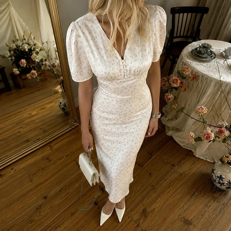 Floral dress dress in white with puff sleeves, perfect for summer occasions