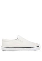 White slip-on sneaker with black sole on a light blue background