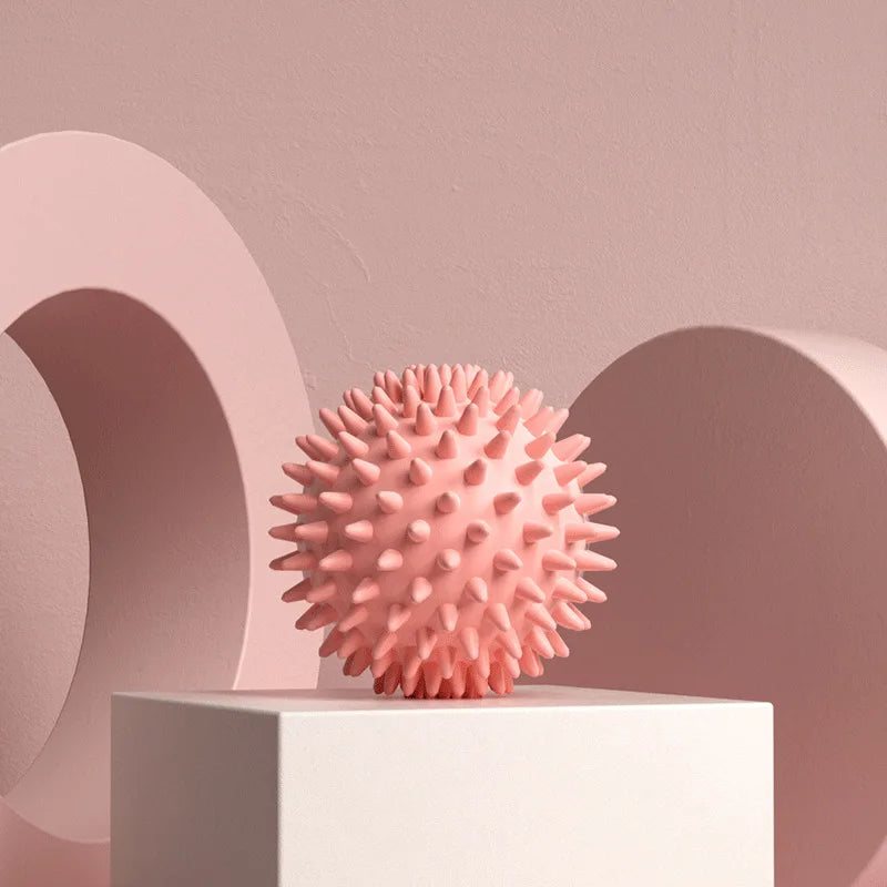 Pink spiky massage ball for muscle relaxation and tension relief
