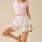 Women's mini skirt in white floral print, perfect for summer outings