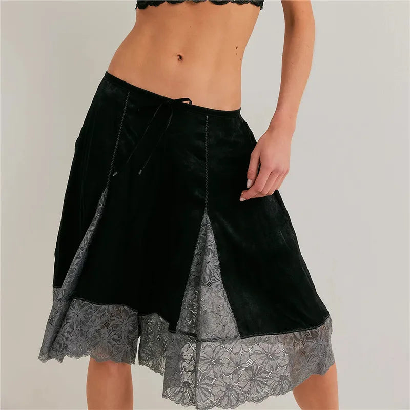 Women's black satin pajamas with lace detail for comfortable lounging