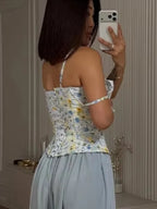 Women's floral top cami in pastel colors, perfect for warm weather