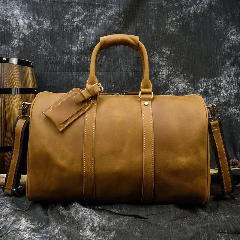 Brown leather travel bag, ideal for weekend getaways and travel