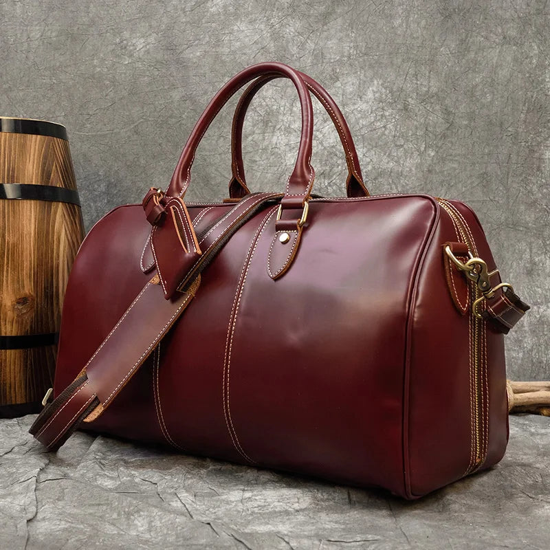 Maroon leather travel bag, perfect for weekend getaways