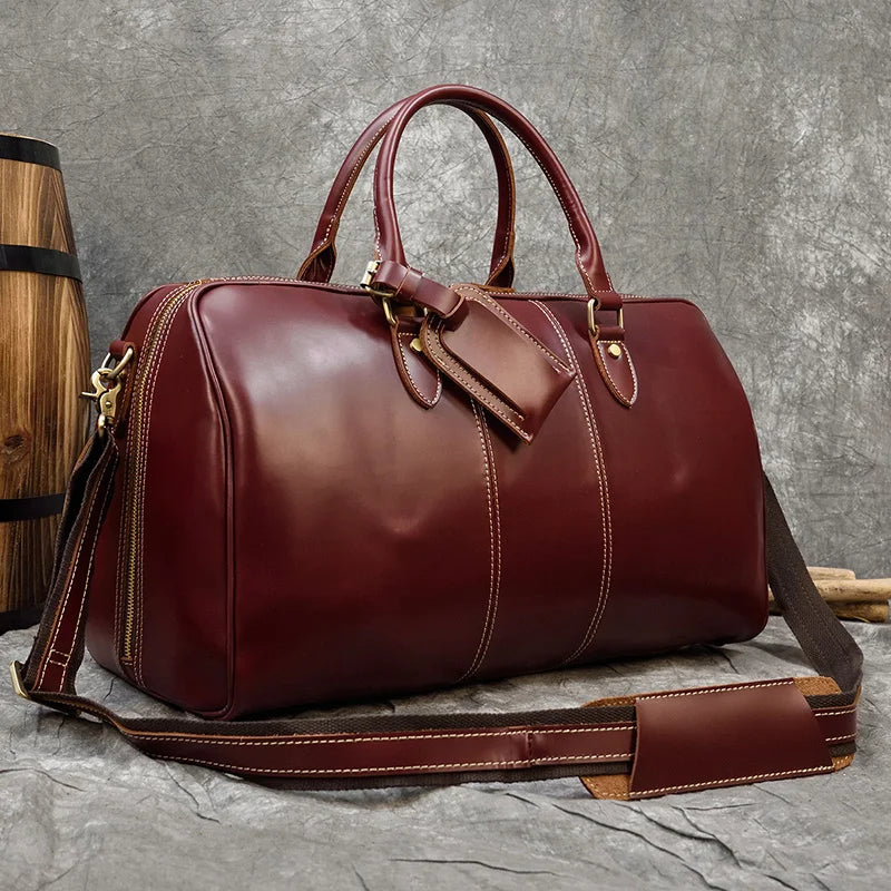 Maroon leather duffle travel bag, perfect for weekend trips