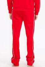 Men's red activewear pants with white side stripes for workouts
