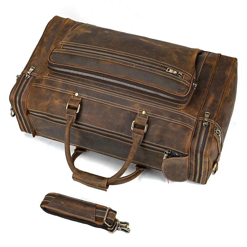 Brown leather weekend bag with multiple zippered pockets for travel