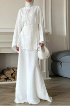 Women's white wrap skirt in lightweight fabric, perfect for elegant occasions