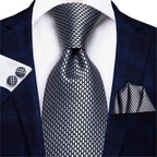 Stylish designer wedding ties for men in gray with a modern pattern and matching pocket square and cufflinks